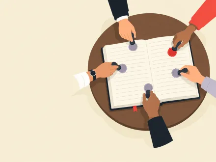 Five hands reach in from every side of a round table, each pressing a seal onto the same open ledger.