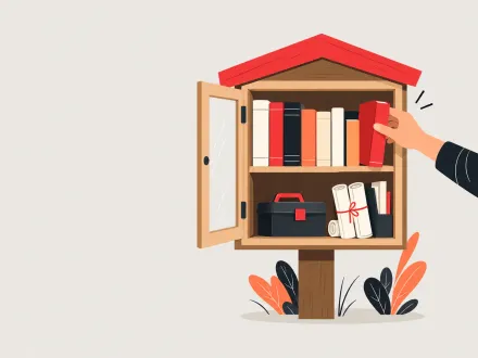 A hand taking a book from a little free library box stocked with books, a toolbox and rolled plans