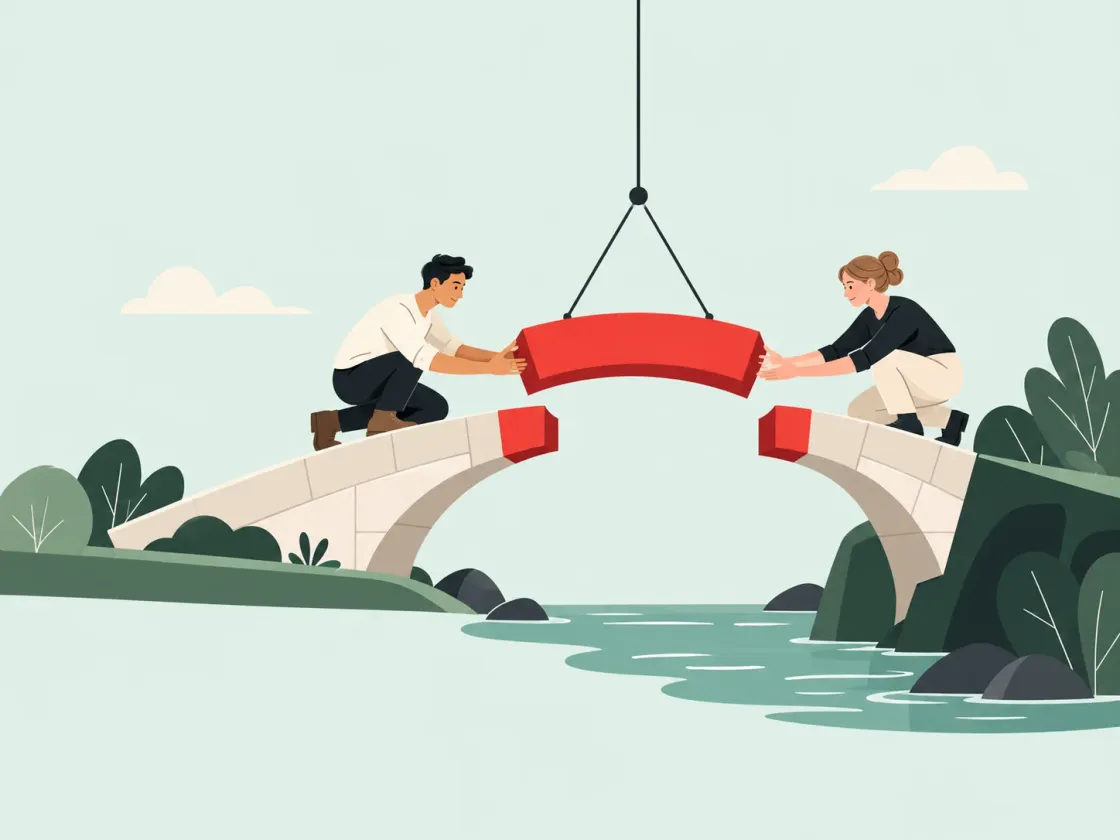Two builders on opposite banks guide the last red section of a stone bridge into place from a crane line.