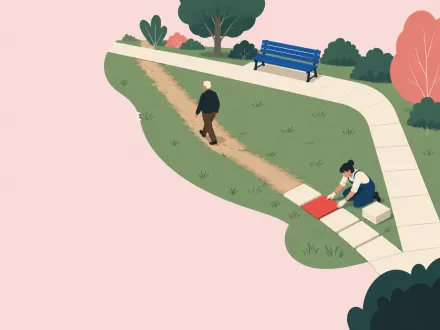 A man walks a worn grass shortcut across a park while a gardener lays paving slabs along it.
